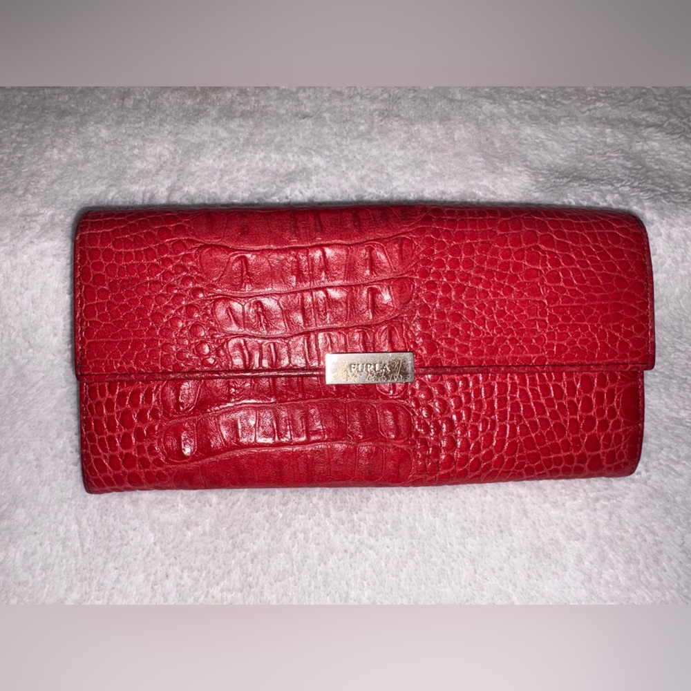 Furla wallet with an alligator-embossed pattern.